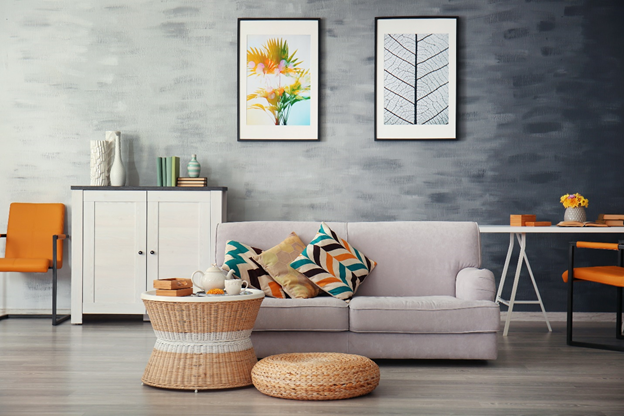 Decorating  your Home - living room with grey wall, white and orange furniture and wood floors.